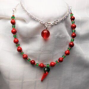 No1074 Handmade necklace with torch-worked glass pieces shaped like a pepper